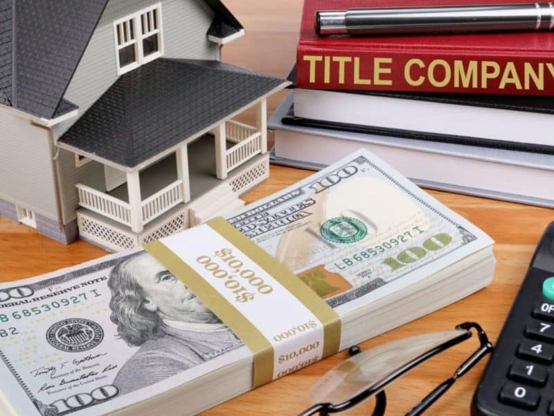 Home buyer reviewing title insurance and closing documents in Texarkana