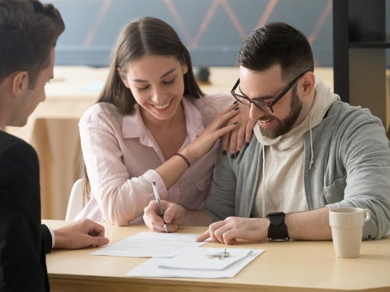 Home buyer reviewing a real estate contract and earnest money requirements